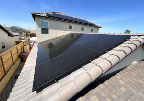 various black solar panels installed on roof with tiles in Bakersfield, CA