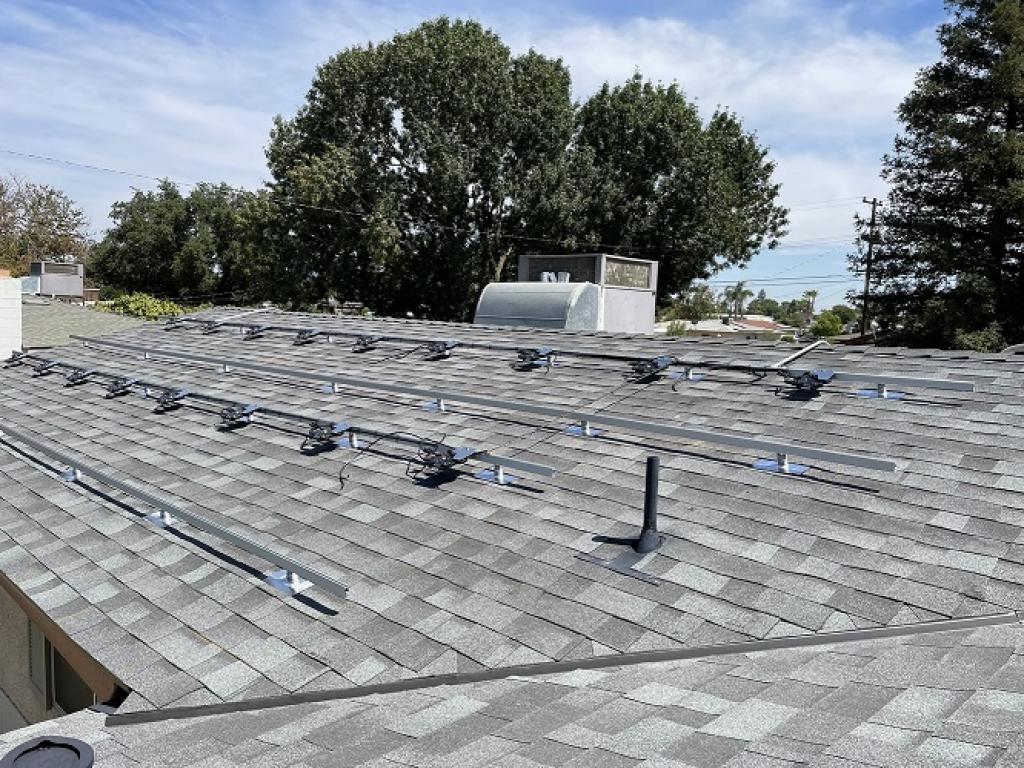 solar panel equipment installed on grey roof